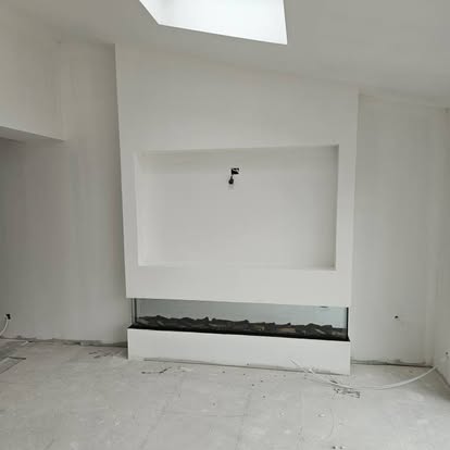 Smooth plaster finish around a recessed media wall